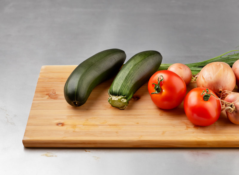 Ash wood cutting board with vegetables